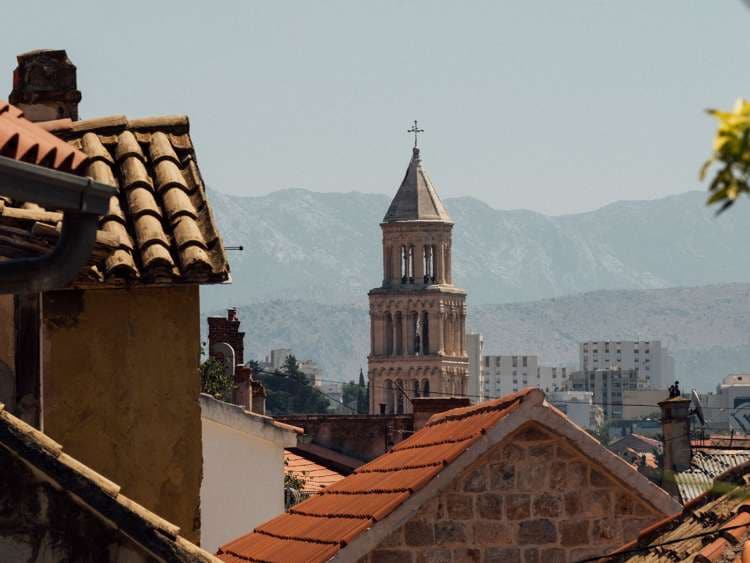 Split bell tower photographed from a roof top