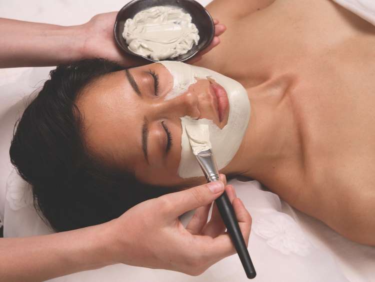 woman having face treatment in the spa