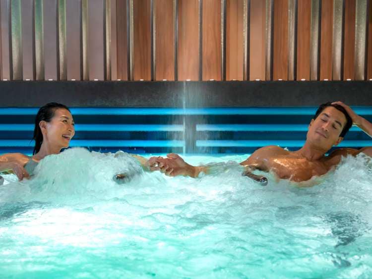 Couple enjoying the hydrotherapy pool on board P&O Cruises ships