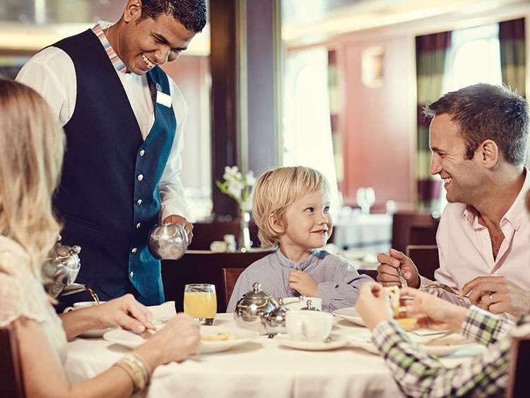 Family getting served in restaurant