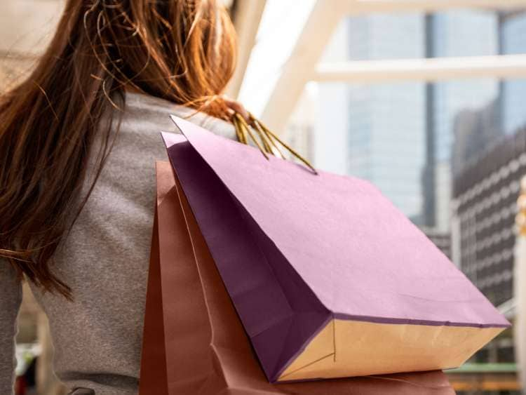 Woman carrying her shopping bags through the ship