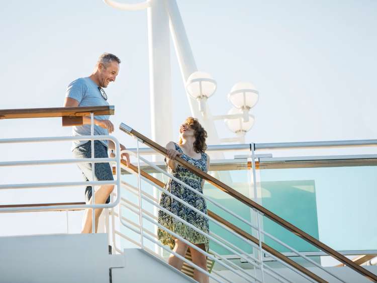  Couple going down the stairs on deck on a P&O Cruises cruise ship