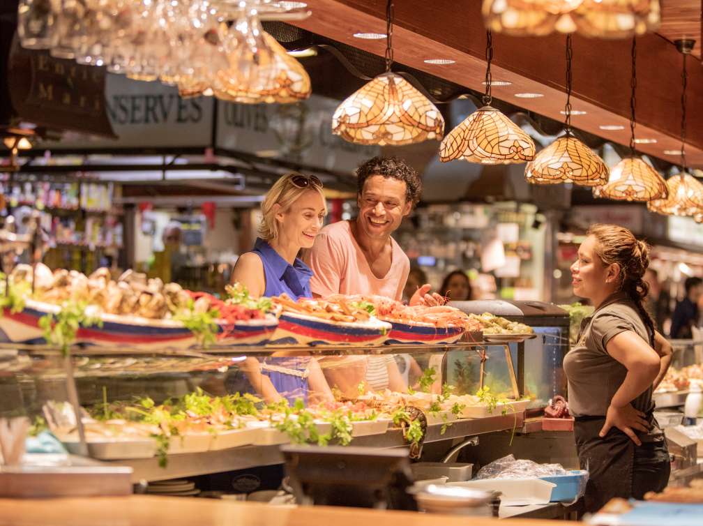 Couple enjoying food at Shore Experience