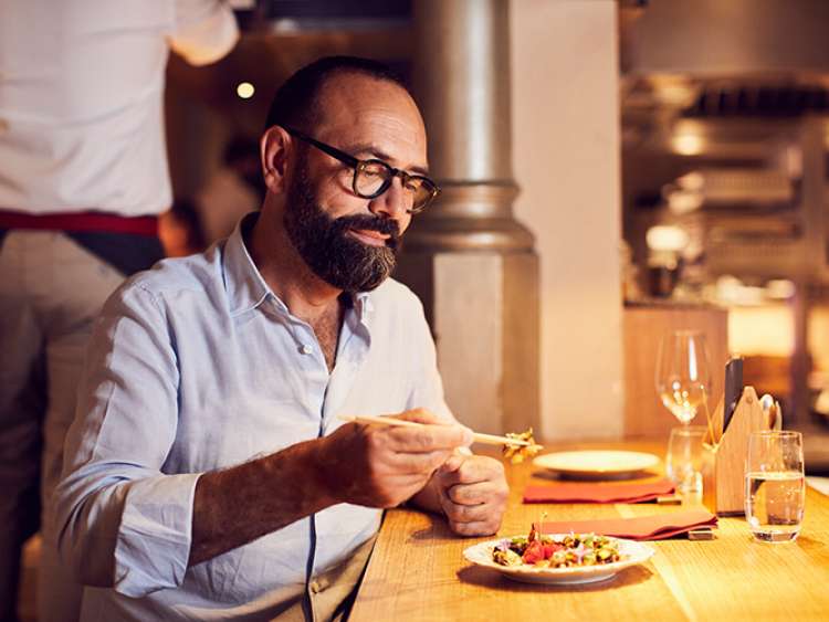 Jose Pizarro eating food at table 