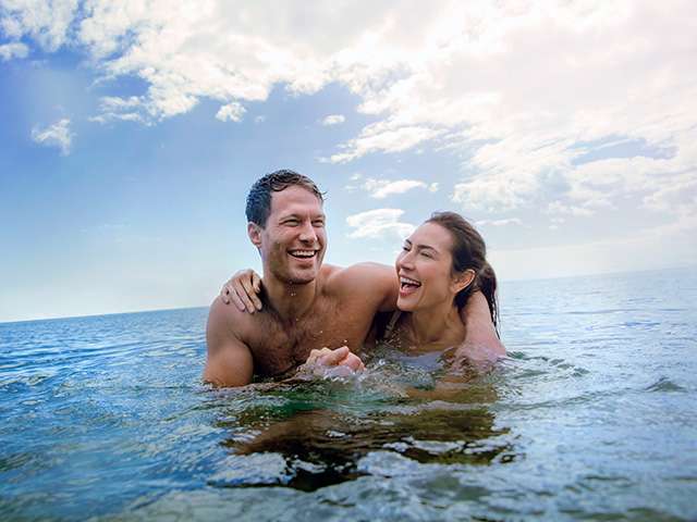 Couple swimming together 