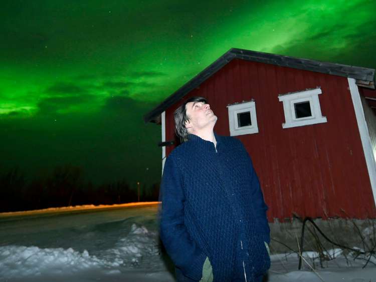 Alex James looking at the Northern Lights in Norway
