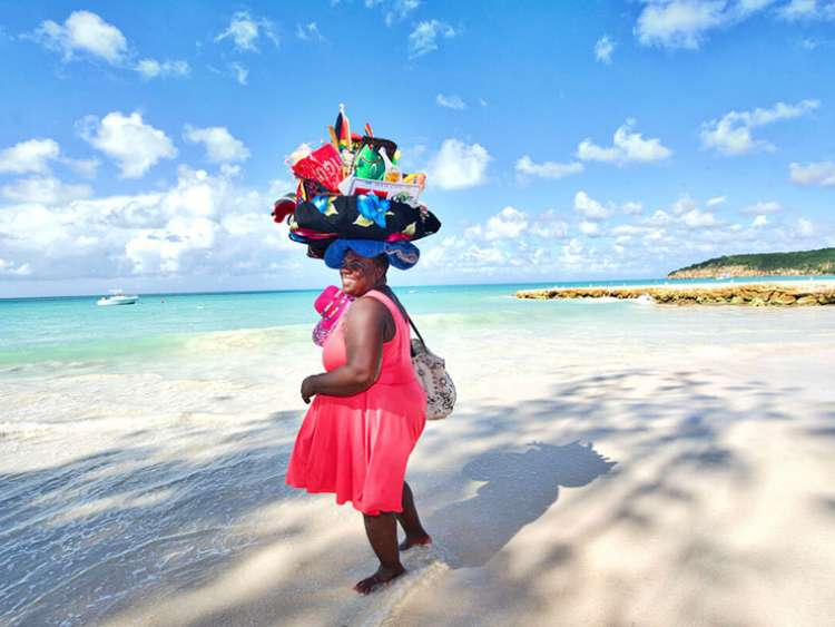 Caribbean lady selling souvenirs on the beach