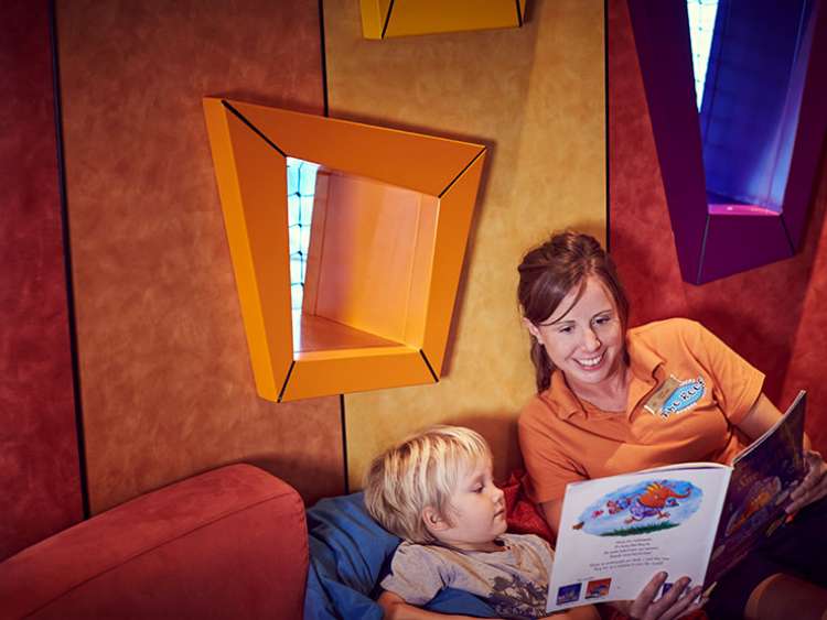 Reef Child Minder reading a story to a child