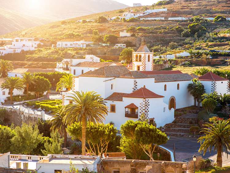 View on Betancuria village with church tower on Fuerteventura island in Spain; Shutterstock ID 393006481; Project: moments