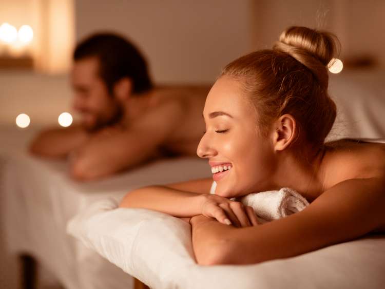 Spouses Receiving Relaxing Beauty Treatment Enjoying Aromatherapy Or Waiting For Exotic Back Massage Lying With Eyes Closed At Luxury Spa Center. Wellness And Body Relaxation. Selective Focus