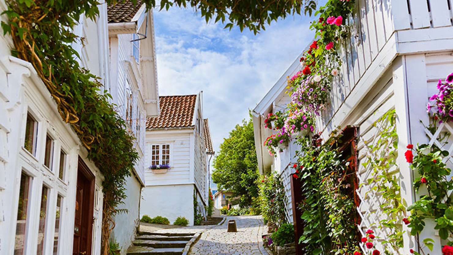 Cobbled path between white cottages in Old Stavanger