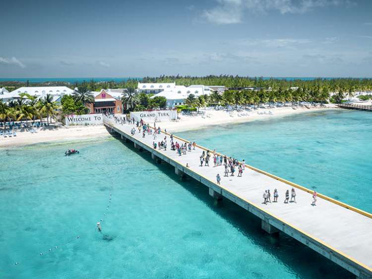 People walking down the Grand Turk pier