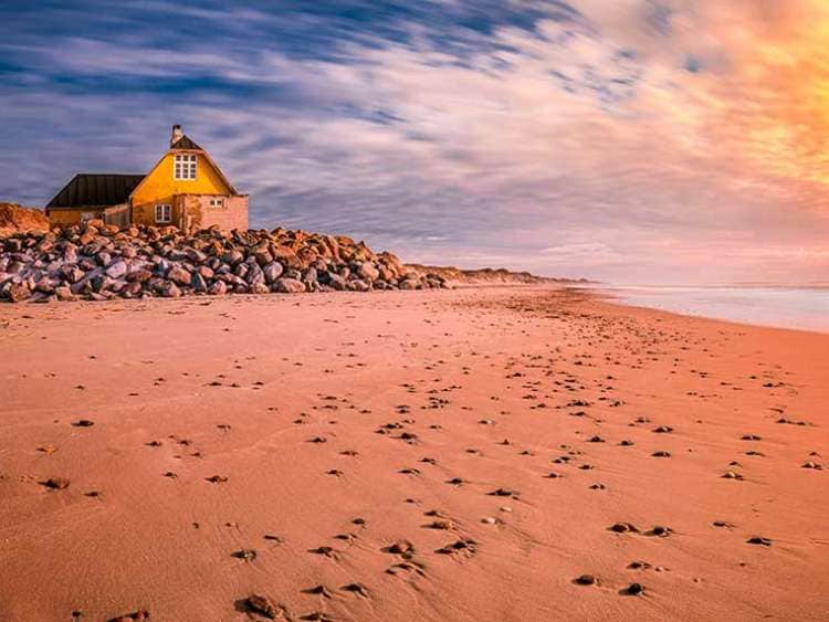 Skagen beach with beach house on stones