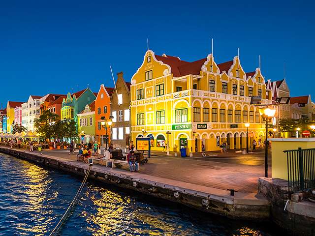 Caribbean town lit up at night 