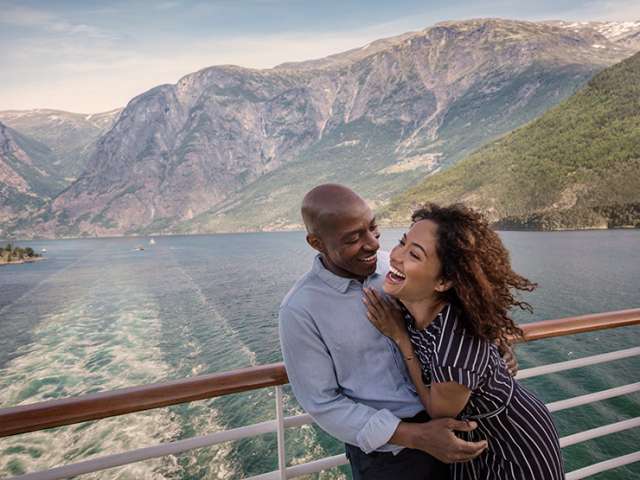 Couple on deck laughing together