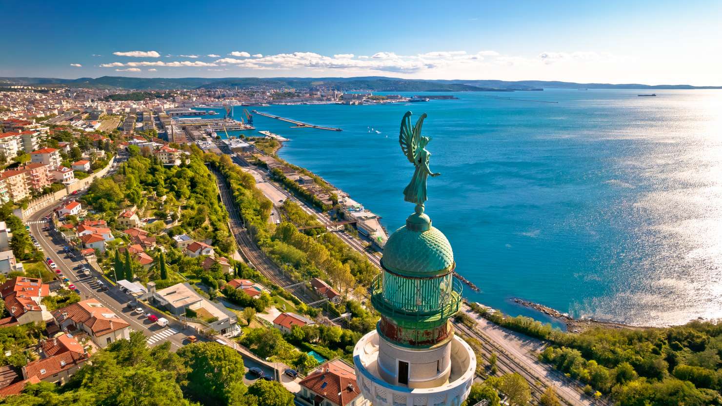 Trieste lighthouse Phare de la Victoire and cityscape panoramic aerial view, Friuli Venezia Giulia region of Italy