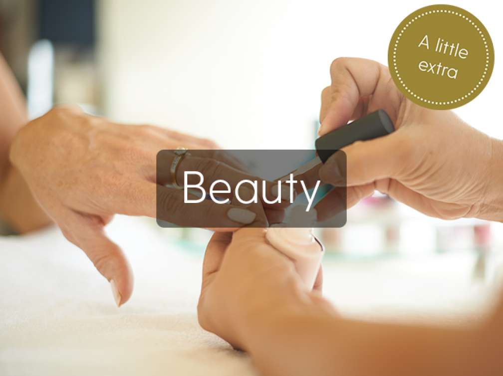 Woman having her nails painted at Spa 