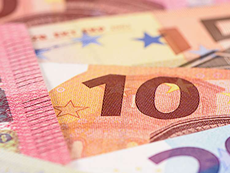 Many Euro banknotes in detail on table; Shutterstock ID 455556115; Project: moments