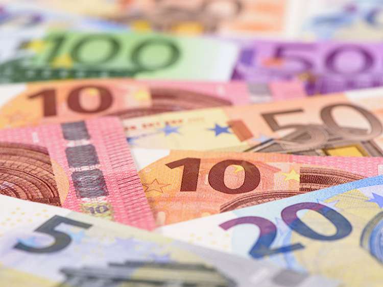 Many Euro banknotes in detail on table; Shutterstock ID 455556115; Project: moments