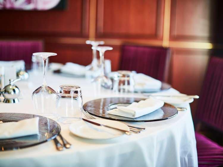 Table set out with plates, glasses and cutlery