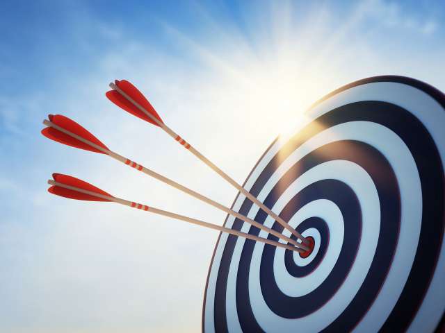 Archery arrows on target board. Archery is available to do on P&O Cruises ship Iona
