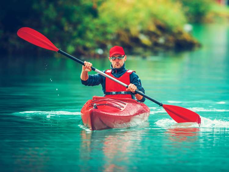 A guy canoeing 