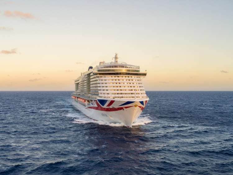 Arvia ship cutting through the ocean in a sunset setting