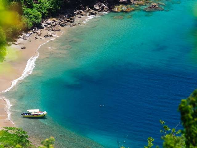 A beautiful, secluded Caribbean beach at the foot of Gros Piton, a UNESCO World Heritage Site in Saint Lucia.