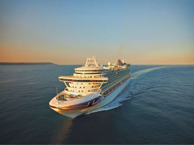 Azura at sea during sunset