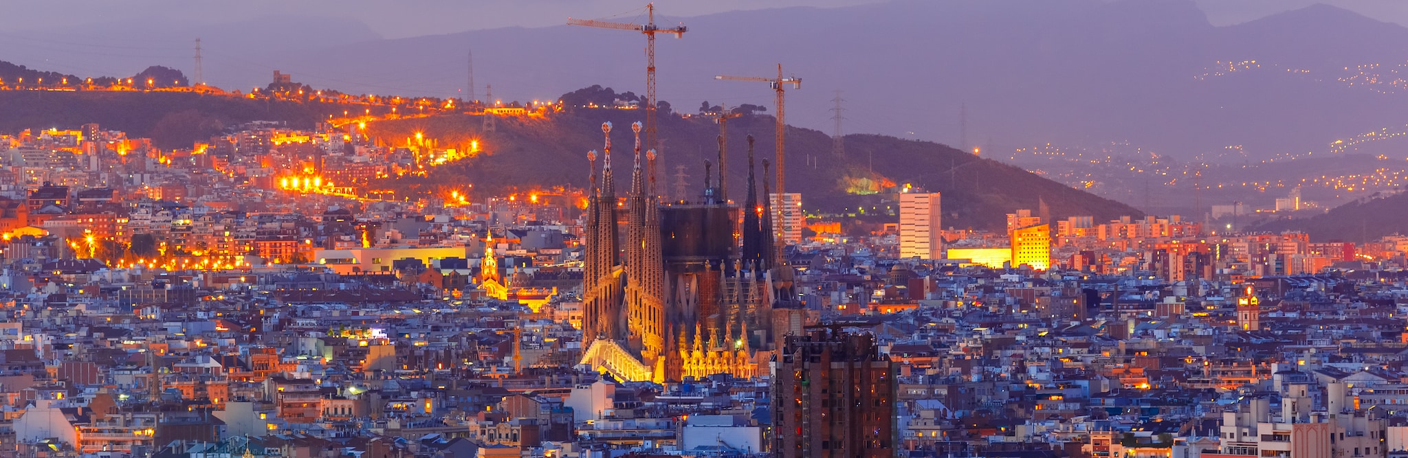 La Sagrada Familia illuminated at night in Barcelona, Spain