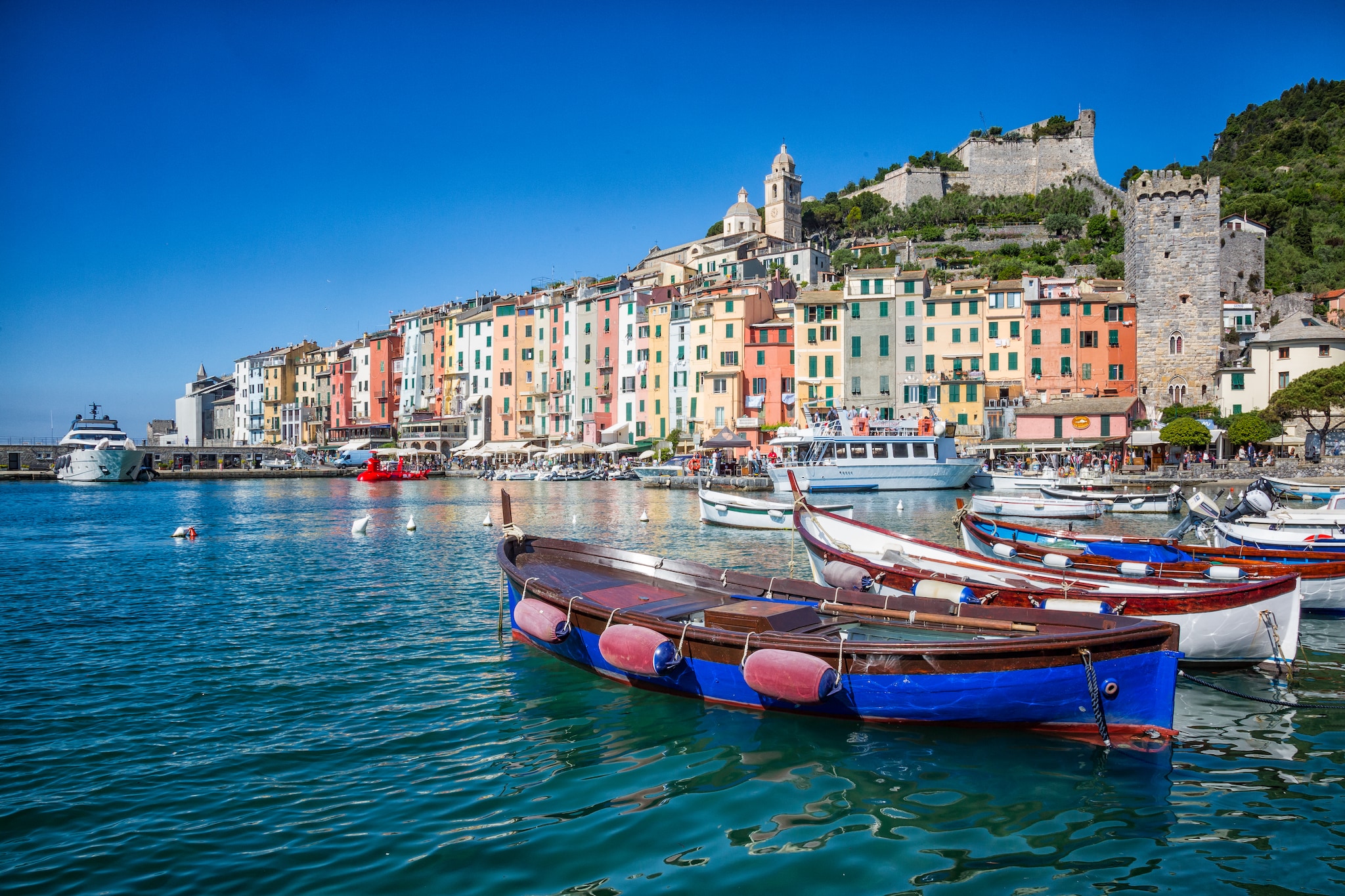 Pretty Porto Venere with medieval castles and pastel-painted houses and wooden boats are picture perfect for the Ligurian Coast