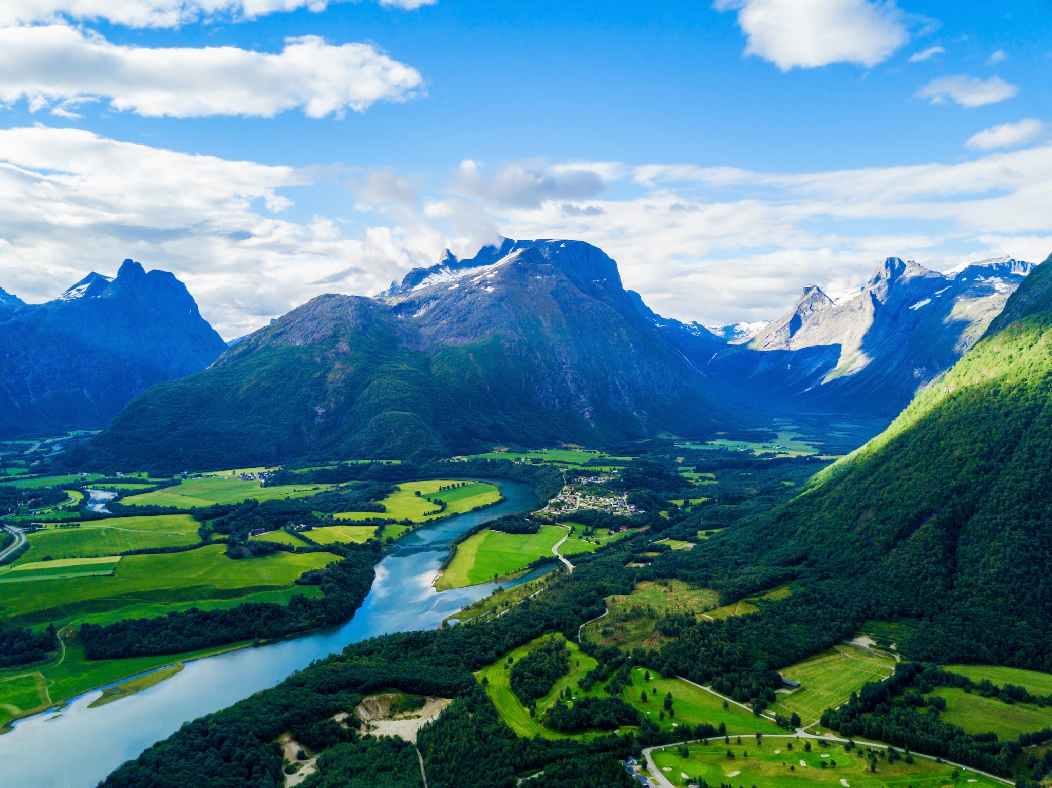 {"metadata_en_GB":{"alt-text":" Mountains and greenery with a river through the middle"},"metadata_en_AU":{"alt-text":" Mountains and greenery with a river through the middle"}}