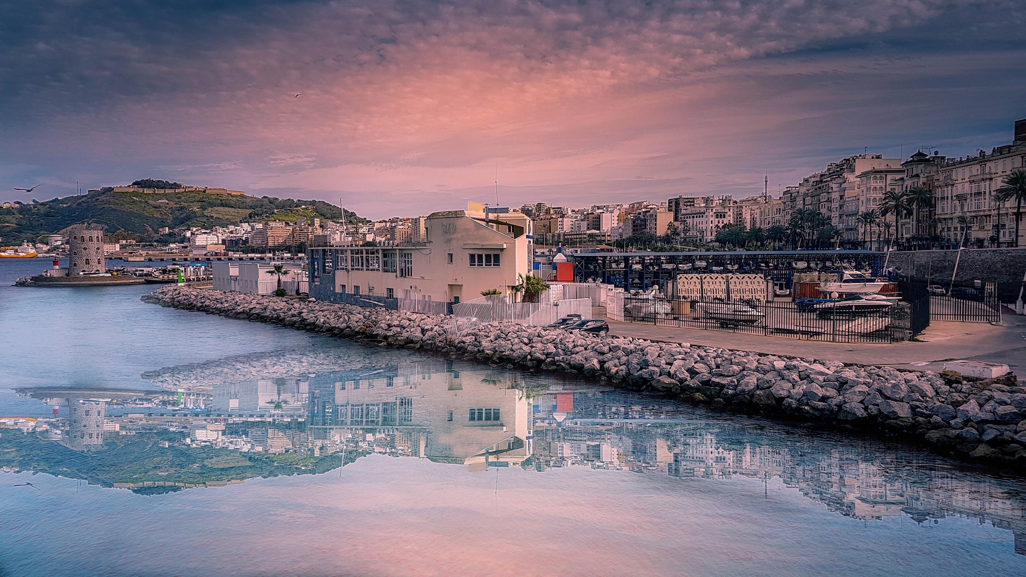 {"metadata_en_GB":{"alt-text":"Buildings by the sea"},"metadata_en_AU":{"alt-text":"Buildings by the sea"}}