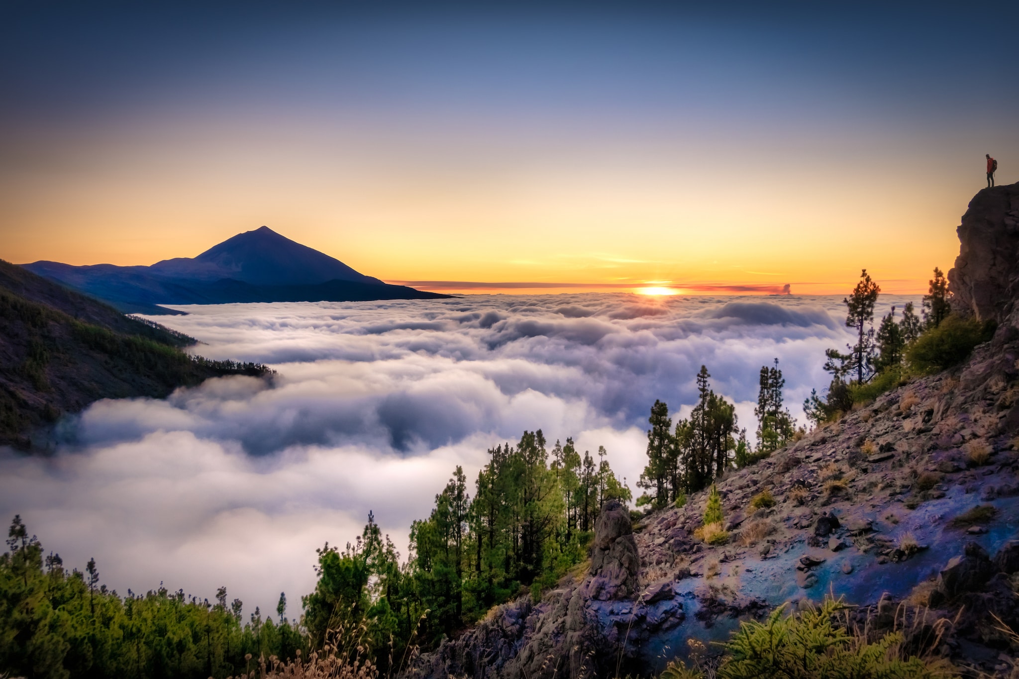 Views Of Teide With Clouds and the volcano of La Palma erupting in the background. Can see the column of smoke caused by the Cumbre Vieja volcano