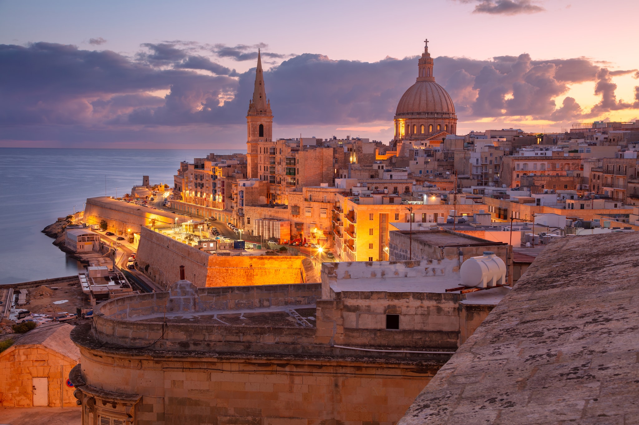 Cityscape image of historical old town of Valletta, Malta with Basilica of Our Lady of Mount Carmel at beautiful autumn sunrise.