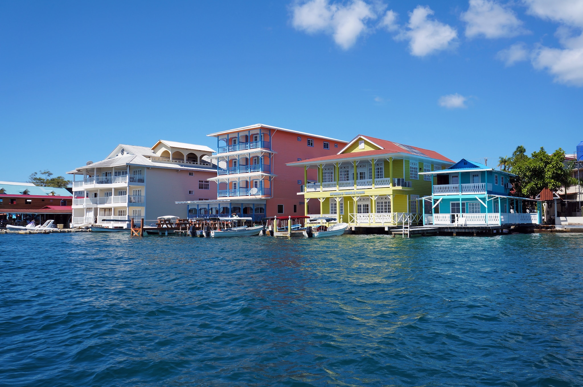 {"metadata_en_GB":{"alt-text":"Colourful buildings looking out to sea"},"metadata_en_AU":{"alt-text":"Colourful buildings looking out to sea"}}