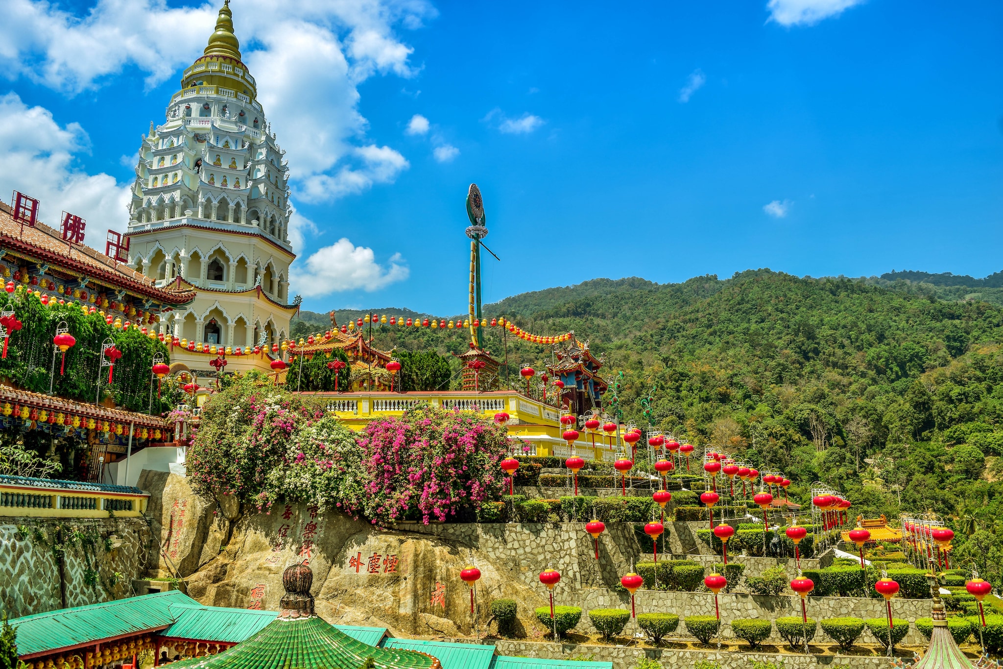 {"metadata_en_GB":{"alt-text":"Temple decorated with flowers and lanterns "},"metadata_en_AU":{"alt-text":"Temple decorated with flowers and lanterns "}}