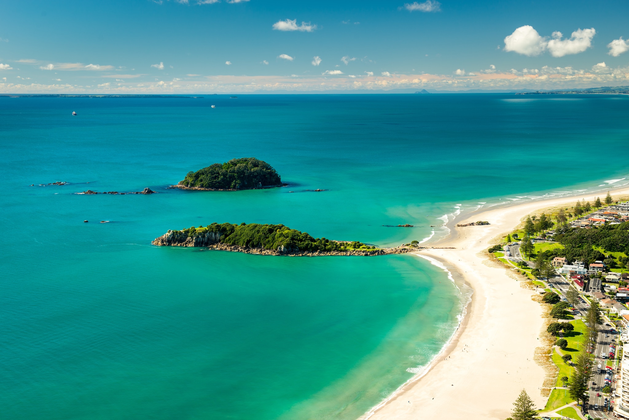 {"metadata_en_GB":{"alt-text":"Blue sea by sandy beach"},"metadata_en_AU":{"alt-text":"Blue sea by sandy beach"}}
