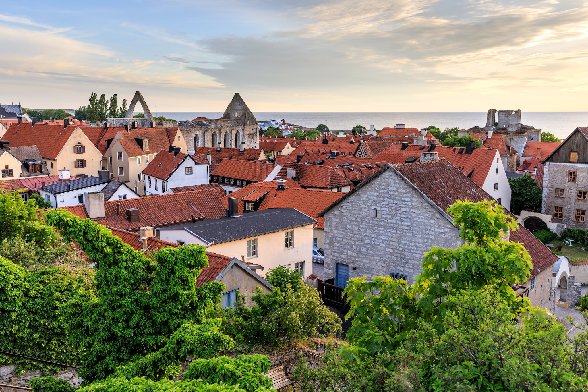 {"metadata_en_GB":{"alt-text":"Sky view of houses and an old church"},"metadata_en_AU":{"alt-text":"Sky view of houses and an old church"}}