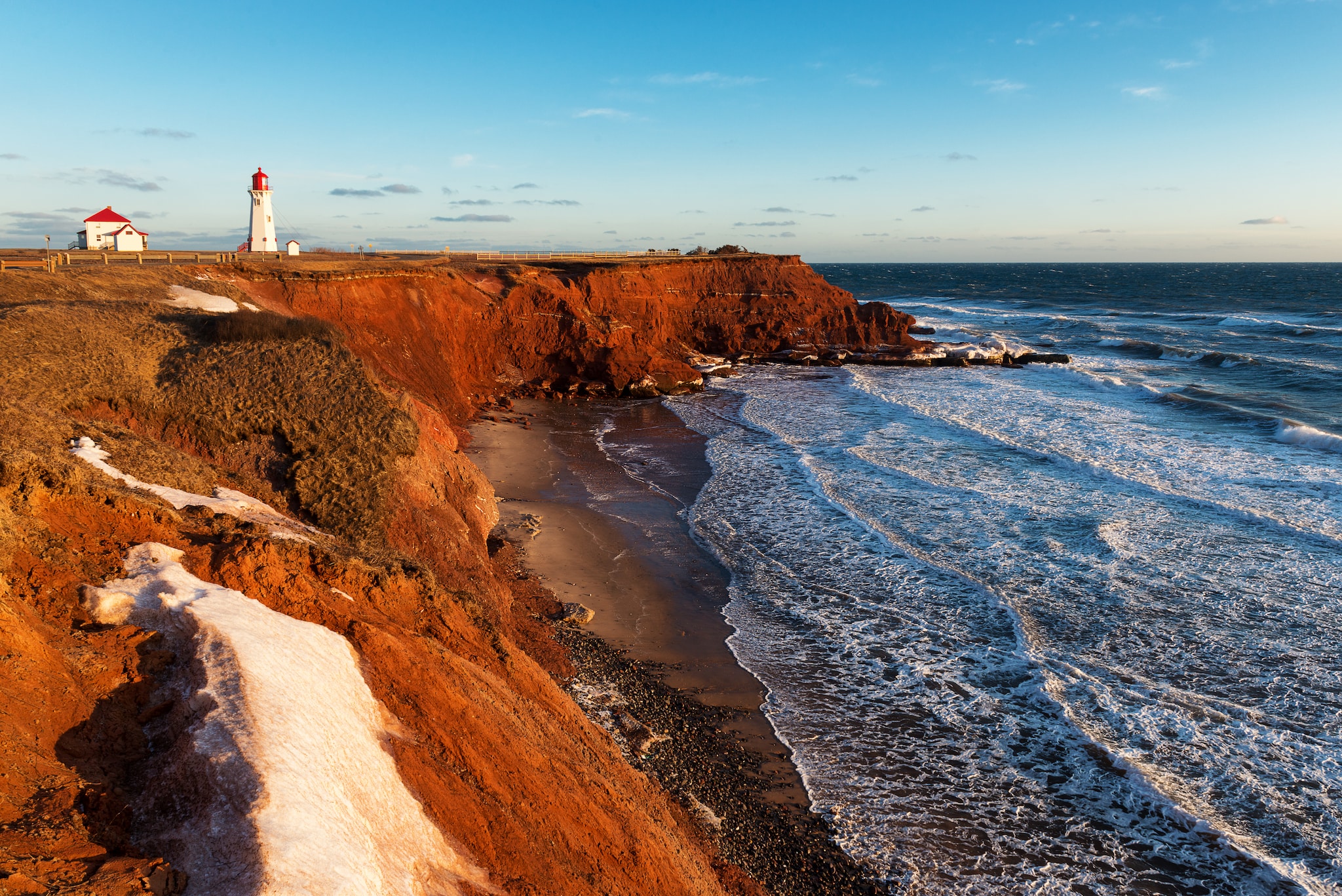 {"metadata_en_GB":{"alt-text":" A red cliff next to the sea"},"metadata_en_AU":{"alt-text":" A red cliff next to the sea"}}