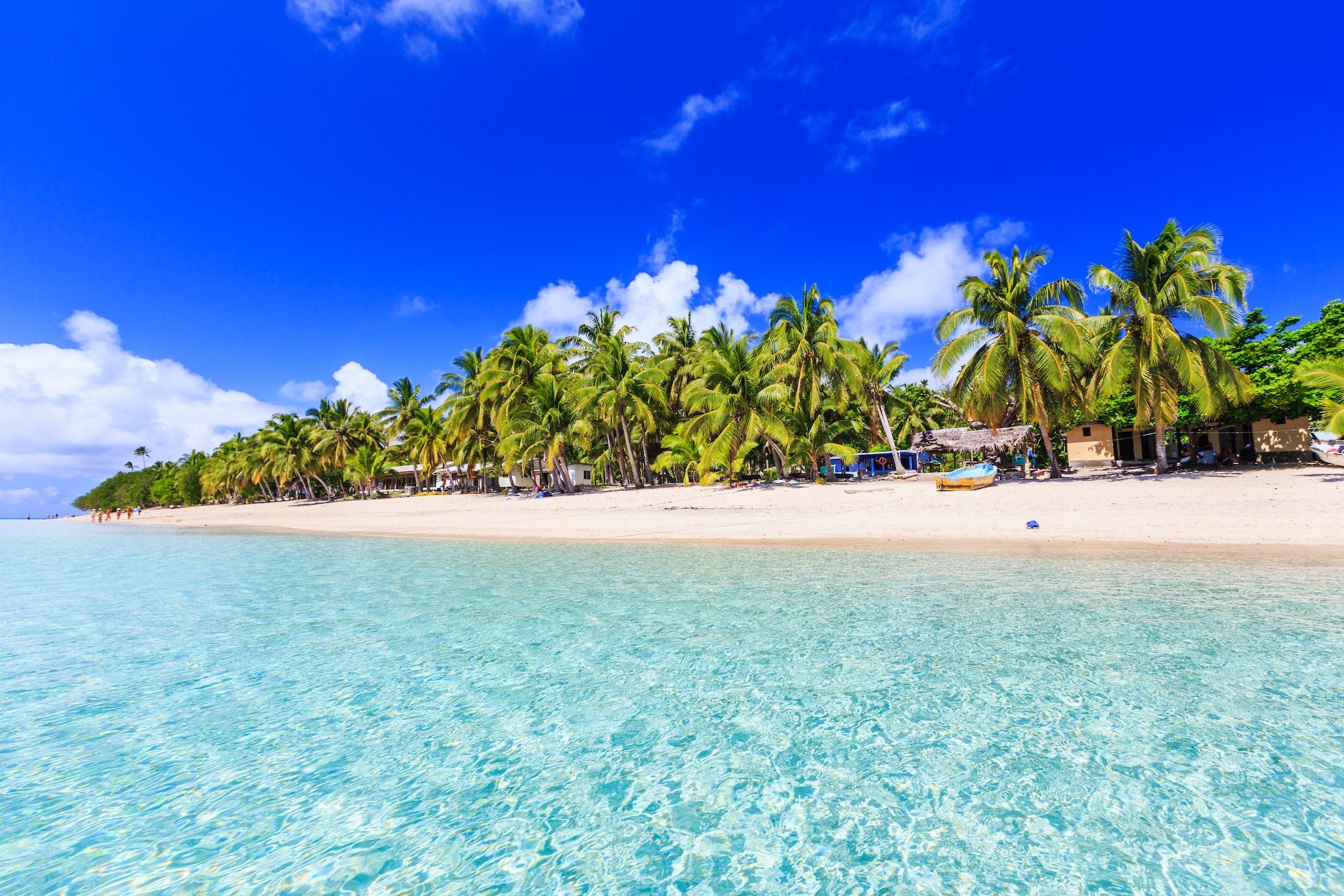 Beach on a tropical island with clear blue water. Dravuni Island, Fiji.