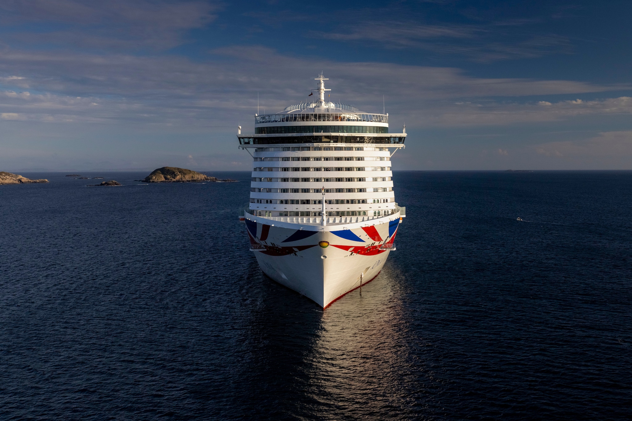 {"metadata_en_GB":{"alt-text":"Immediate release: Monday August 9, 2021 - Editorial free to use image\n\nA new era in travel as P&O Cruises Iona makes maiden voyage to namesake island\n\nBritains largest and most environmentally-friendly cruise ship, P&O Cruises Iona, has embarked on its maiden voyage visiting its Scottish namesake island with a fireworks display tonight as the highlight of celebrations.\n\nP&O Cruises President Paul Ludlow said: \n\nIonas maiden voyage is the start of a new era in travel as Britains most environmentally-friendly cruise ship, the first in the country powered by liquefied natural gas, sets sail.\n\nFor this special maiden voyage we wanted to bring guests to the island of Iona which has influenced many aspects of the ship  the sense of space in the SkyDome through to our gin still named Columba, the heather in our Marabelle gin distilled on board, and, of course, its name.\n\nIonas first-ever cruise is currently sailing around the UK coast for seven nights, having departed the home port of Southampton on August 7, 2021.\n\nThe ship is at anchor adjacent to the island of Iona ahead of commencing scenic cruising around the Isle of Colonsay, Lochbuie, Duart Castle, Tobermory, Bac Mòr, Fingals Cave, Sound of Jura, Claggain Bay, Mull of Kintyre and Sanda Island.\n\nIona features the first gin still on a cruise ship, created in association with Salcombe Gin, distilling tailor made spirit on board. The gins maiden production will take place in Ionas custom-made still and will be distilled, bottled and labelled on board.\n\nGary Barlow is music director of Ionas 710 Club. This atmospheric late-night music venue will offer an opportunity for up-and-coming musicians to get their break.\n\nSpectacular aerial shows have also been especially devised for Iona, the brainchild of Canadian entertainment company Creativiva. The ships stunning design, featuring a two-deck glass SkyDome, has been the inspiration for one of the shows, Rise, created to re"}}