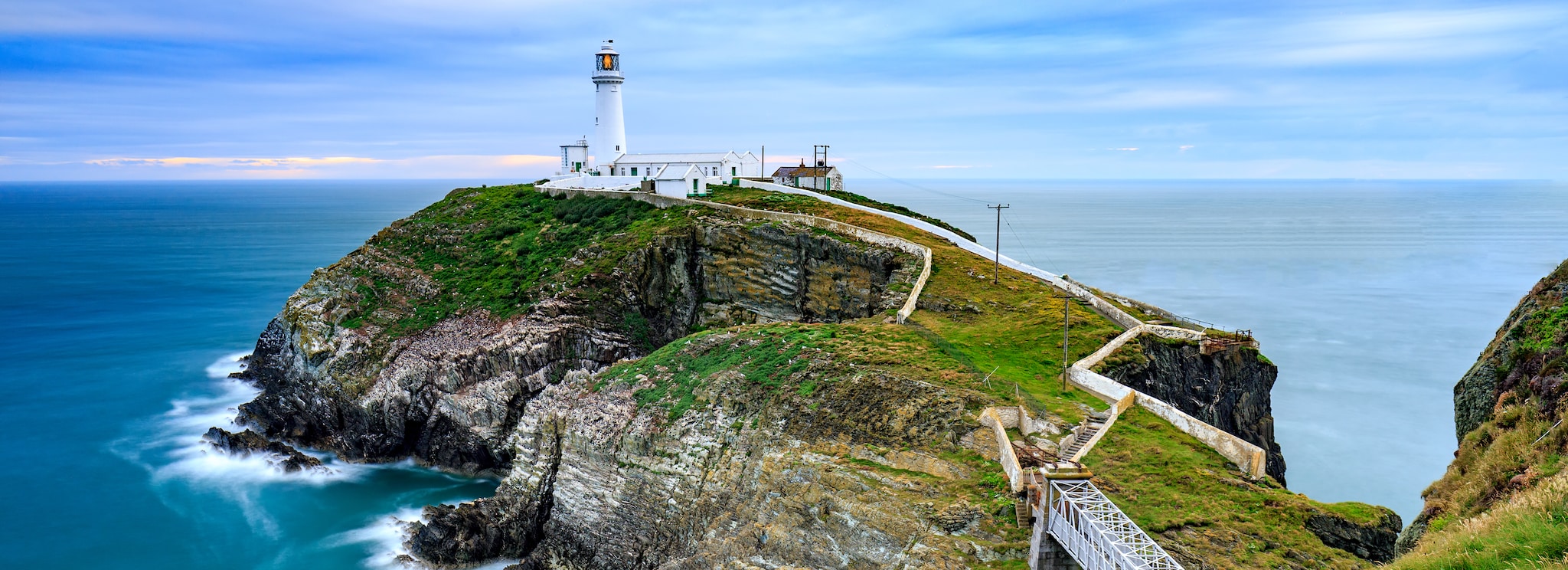 {"metadata_en_GB":{"alt-text":"Lighthouse by the sea in Holyhead "},"metadata_en_AU":{"alt-text":"Lighthouse by the sea in Holyhead "}}