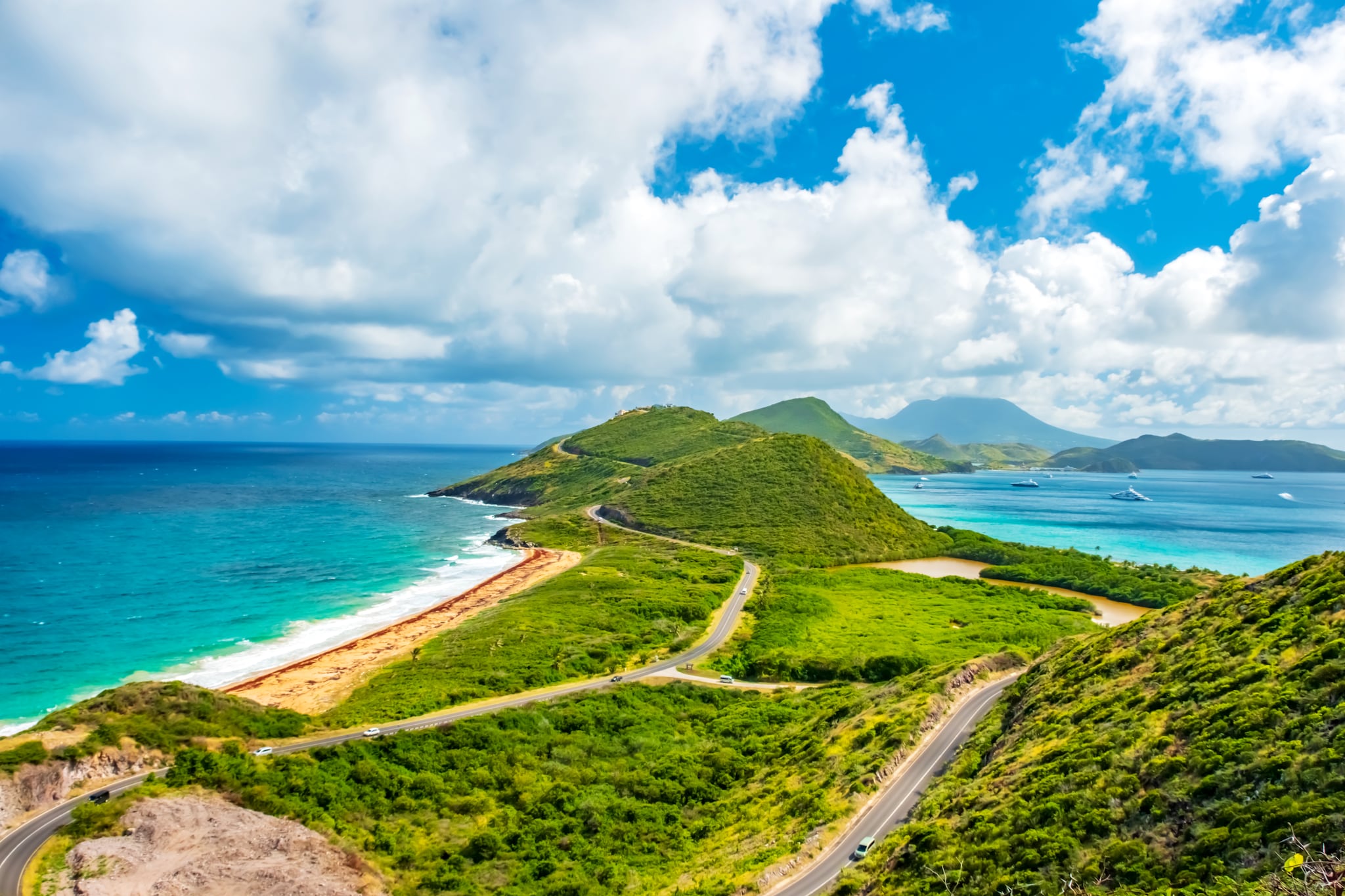 {"metadata_en_GB":{"alt-text":"A Panoramic view, Saint Kitts with Nevis Island in the background."}}