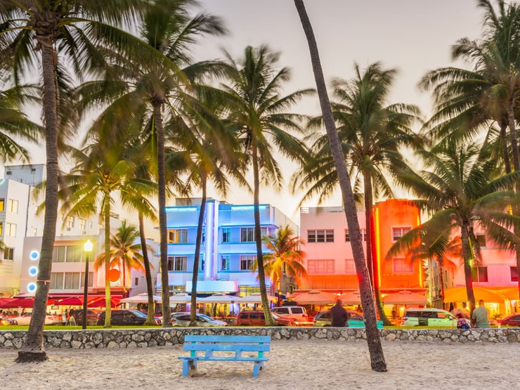 Bench and lit up building on Miami Beach