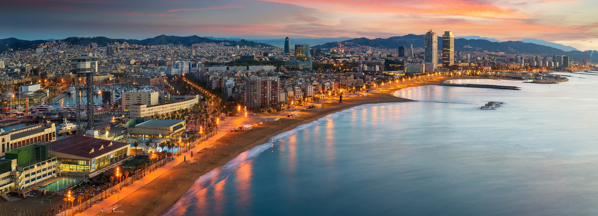 Barcelona beach on morning sunrise with Barcelobna city and sea from the roof top of Hotel, Spain; Shutterstock ID 1074061931; project: po; job: mark; client: po; other: