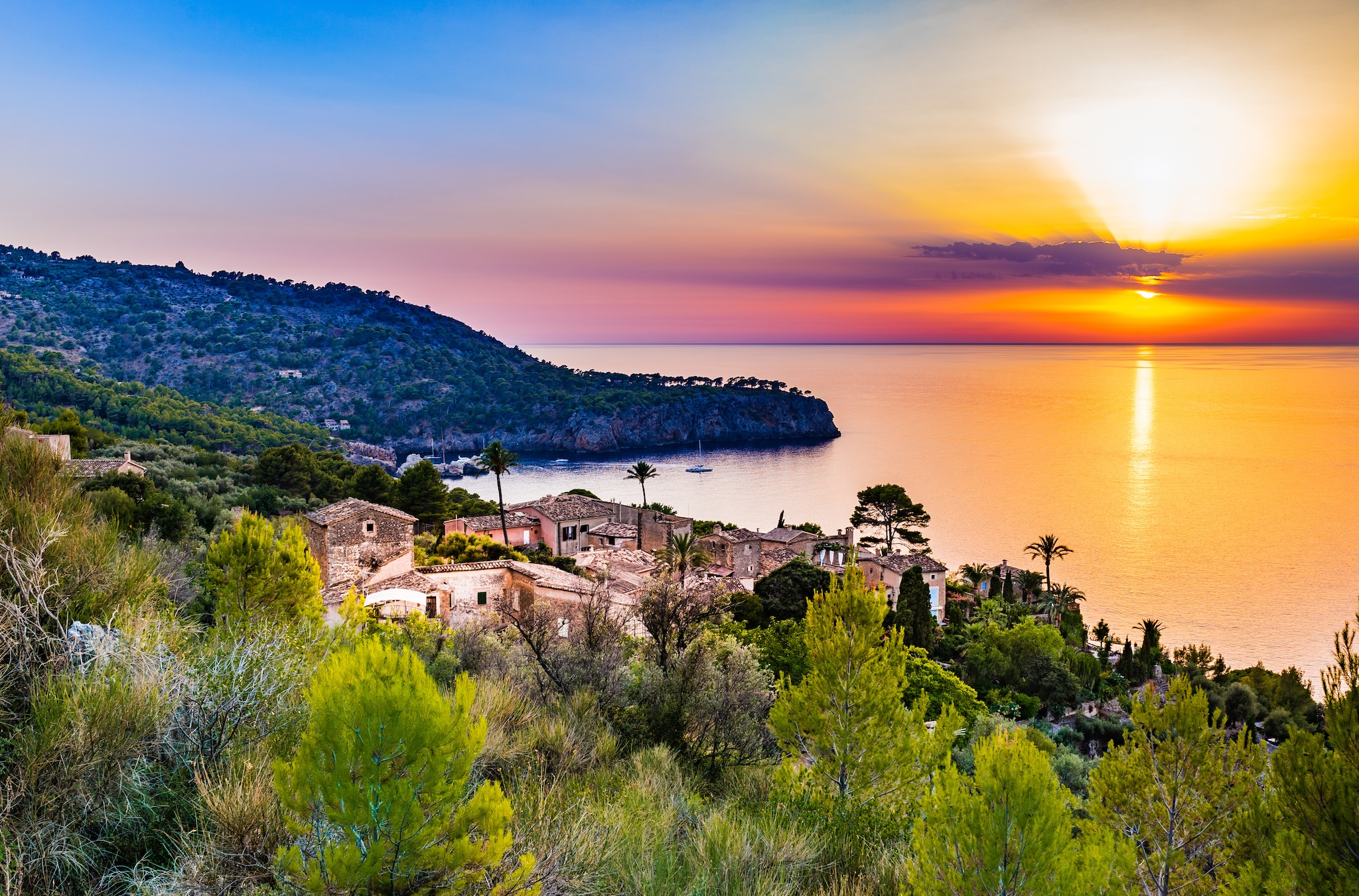 {"metadata_en_GB":{"alt-text":"Beautiful sunset at the coast of Majorca Spain island, quaint village at the seaside of Deia, Mediterranean Sea, Balearic islands.; Shutterstock ID 538125634; project: olly; job: ; client: pocruises; other: "}}