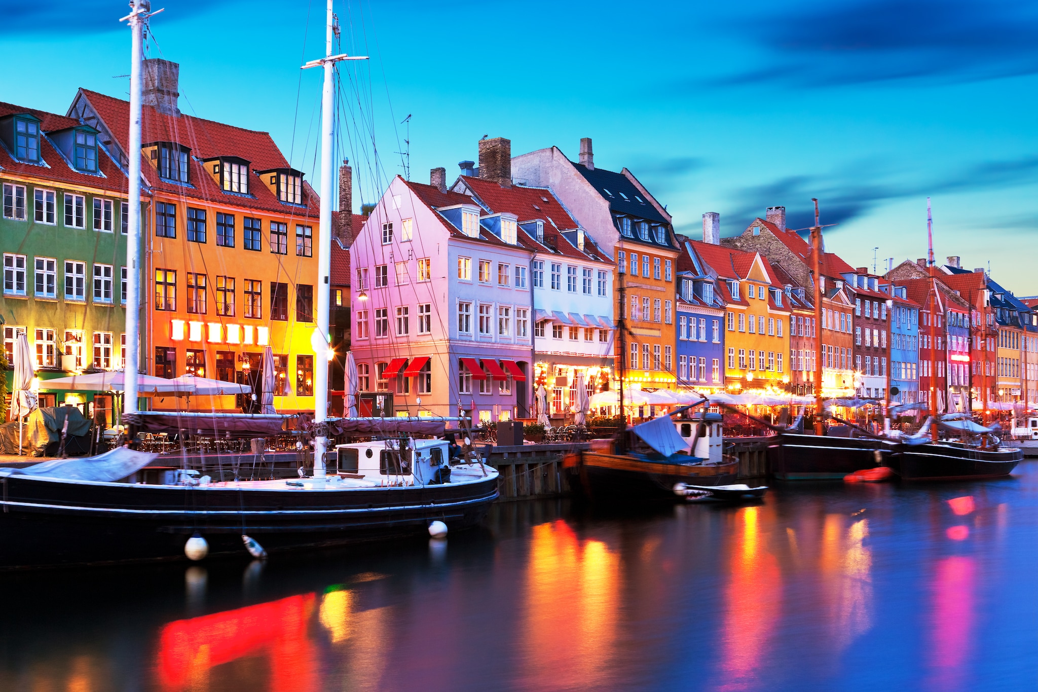 Boats moored alongside Nyhavn Quayside in Copenhagen, Denmark