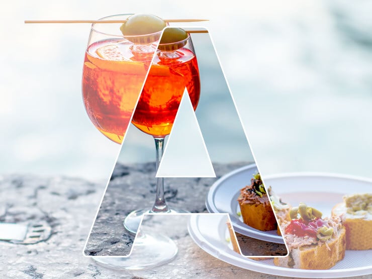 A in front of drink and small tapas plate