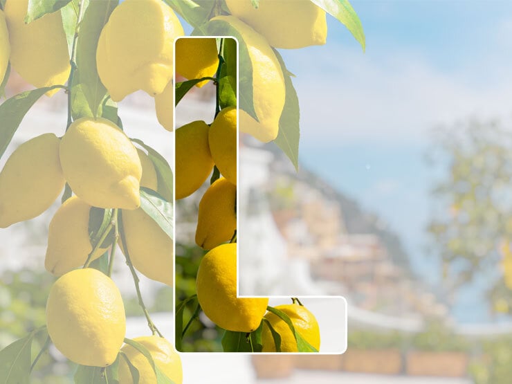 L in front of lemon tree